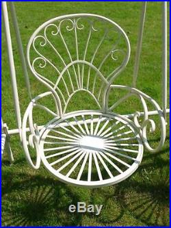 Vintage ornate white metal two seat swing